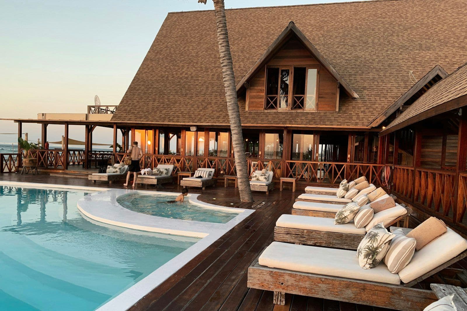 Resort pool surrounded by palms